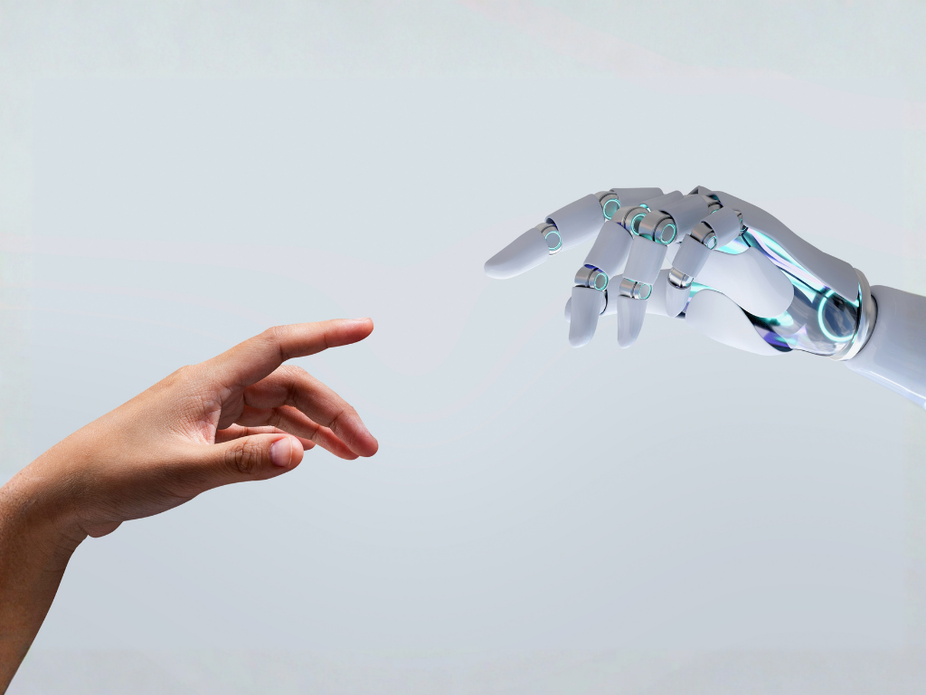Menschliche Hand und Roboterhand